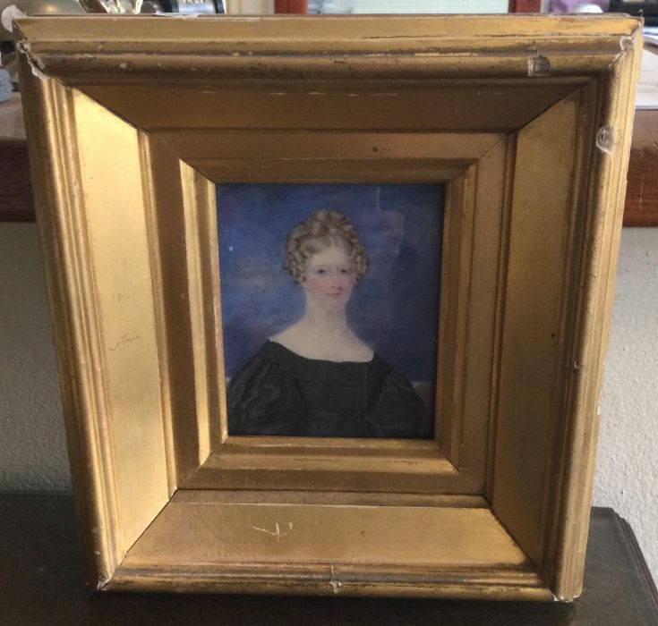A gilt framed miniature watercolour depicting a lady in blue gown. Labelled verso and inscribed "Buc