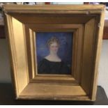 A gilt framed miniature watercolour depicting a lady in blue gown. Labelled verso and inscribed "Buc