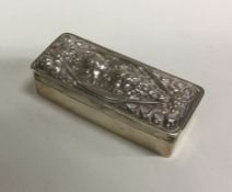 A chased silver figural box with lift-off cover be