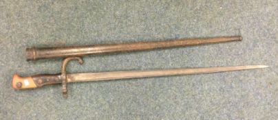 An old bayonet. Est. £30 - £40.