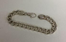 A heavy silver curb link bracelet. Approx. 44.3 gr