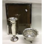 A silver picture frame together with a sugar bowl