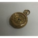 A lady's 18 carat gold engraved fob watch. Approx.