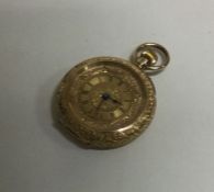 A lady's 18 carat gold engraved fob watch. Approx.