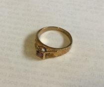 An amethyst single stone ring in 9 carat setting.