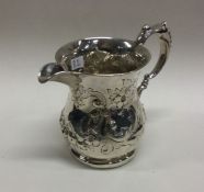 WITHDRAWN: A heavy Victorian silver jug embossed