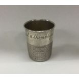 A novelty American silver cup inscribed, 'Just a T
