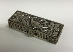 A Continental silver snuff box chased with flowers