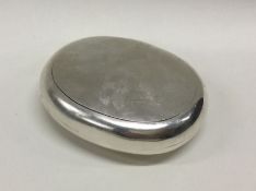 A heavy silver squeeze sided snuff box with gilt i