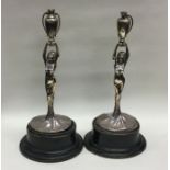 A pair of silver mounted figures in the form of la