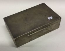 An engine turned silver hinged top cigarette box.