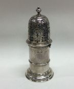 An early Queen Anne silver sugar caster in the for