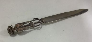 A novelty silver letter opener with thistle decora
