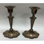 A pair of Edwardian silver candlesticks. Approx. 7