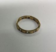 A 9 carat full eternity ring. Approx. 2 grams. Est