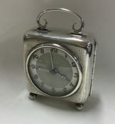 A large silver mantle clock with engine turned dec