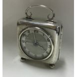 A large silver mantle clock with engine turned dec