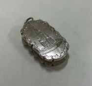 A silver castle top vinaigrette engraved with The