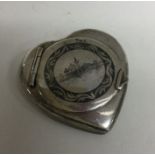An unusual Persian silver and Niello heart shaped