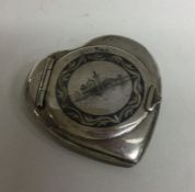 An unusual Persian silver and Niello heart shaped