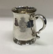 An early 18th Century silver crested mug. London 1