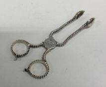 A heavy pair of 18th Century silver sugar nips wit