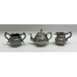 An unusual Chinese silver toy tea service with cha