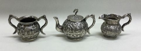 An unusual Chinese silver toy tea service with cha
