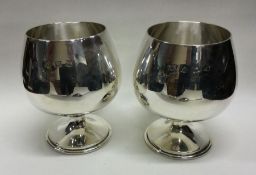 A heavy pair of silver goblets. Birmingham 1972. B