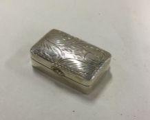An oval silver pill box with chased decoration. Ap