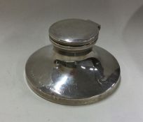 A small circular silver inkwell. Birmingham 1929.