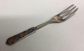An early 20th Century silver and enamelled fork. B
