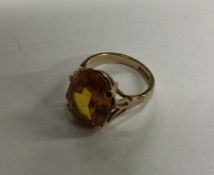 A good large 9 carat single stone ring in claw mou