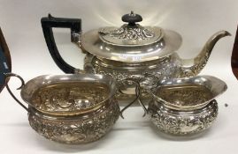 A good chased silver three piece tea service. Appr