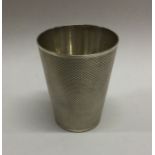 A heavy Victorian silver beaker of textured form.