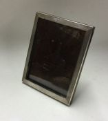 A rectangular silver picture frame with engine tur