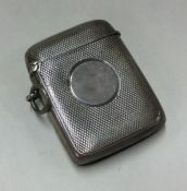 A silver vesta case with engraved decoration and v