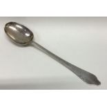 A large heavy Queen Anne silver serving spoon. Lon