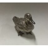 An unusual silver figure of a duck with textured b