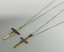 Two 9 carat crosses on fine link chains. Approx. 2