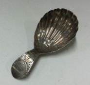 A George III silver caddy spoon.1801. By CH. Appro