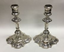 A good pair of cast candlesticks. London 1738. By