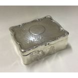 An unusual silver jewellery box with hammered text