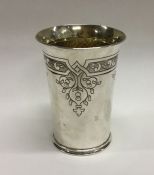 A Charles II style silver beaker with engraved dec