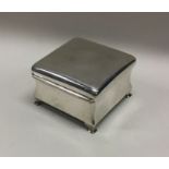 A plain hinged top silver jewellery box with fitte