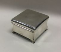 A plain hinged top silver jewellery box with fitte