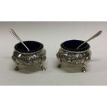 A novelty pair of Victorian silver salts with matc