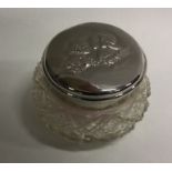 A small chased silver mounted glass dressing table