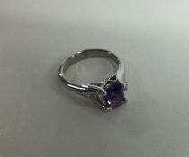 An unusual 18 carat gold amethyst and diamond ring