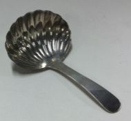 A large George III silver caddy spoon. London 1816